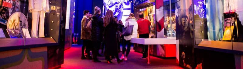 Guests looking at exhibits inside the British Music Experience in Liverpool.