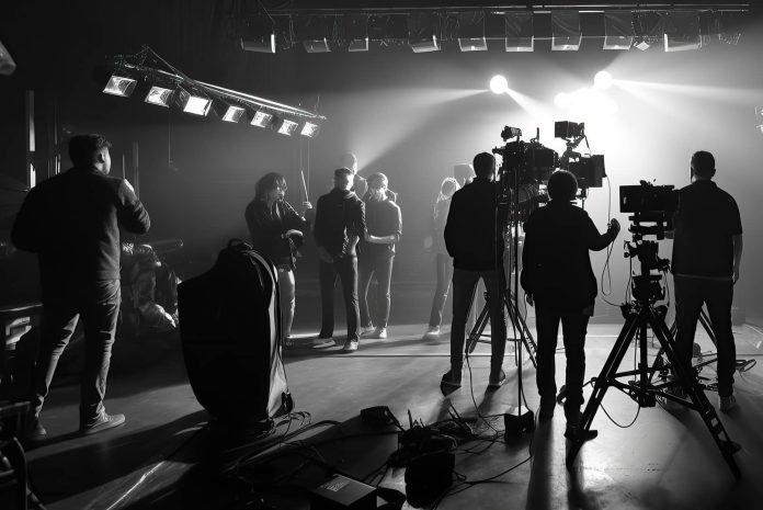 Behind the scenes of a film being shot.